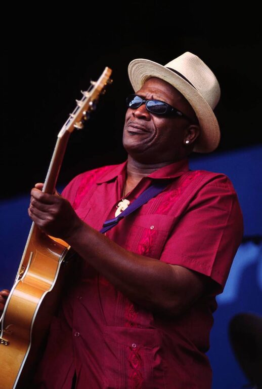 TAJ MAHAL performs with an acoustic guitar at the MONTEREY JAZZ FESTIVAL - CALIFORNIA