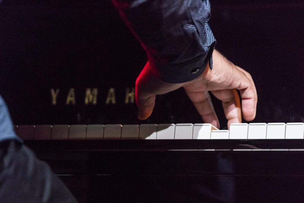 The hands of TERRY BREWER on piano with the BAYLOR PROJECT performing at the 61st Monterey Jazz Festival - MONTEREY, CALIFORNIA